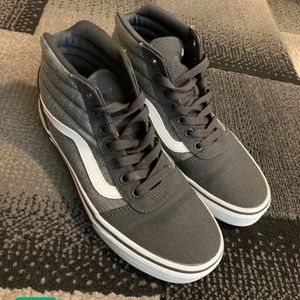 Woman’s high top gray vans